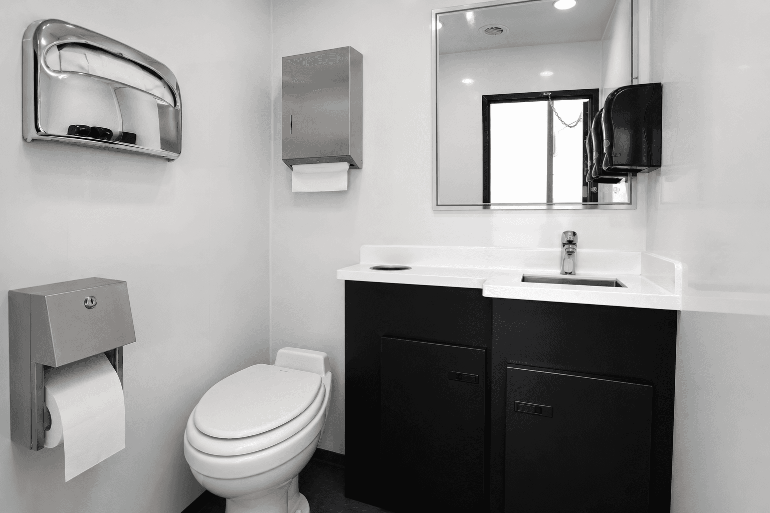 Private stall inside HDR luxury restroom trailer with porcelain flush toilet