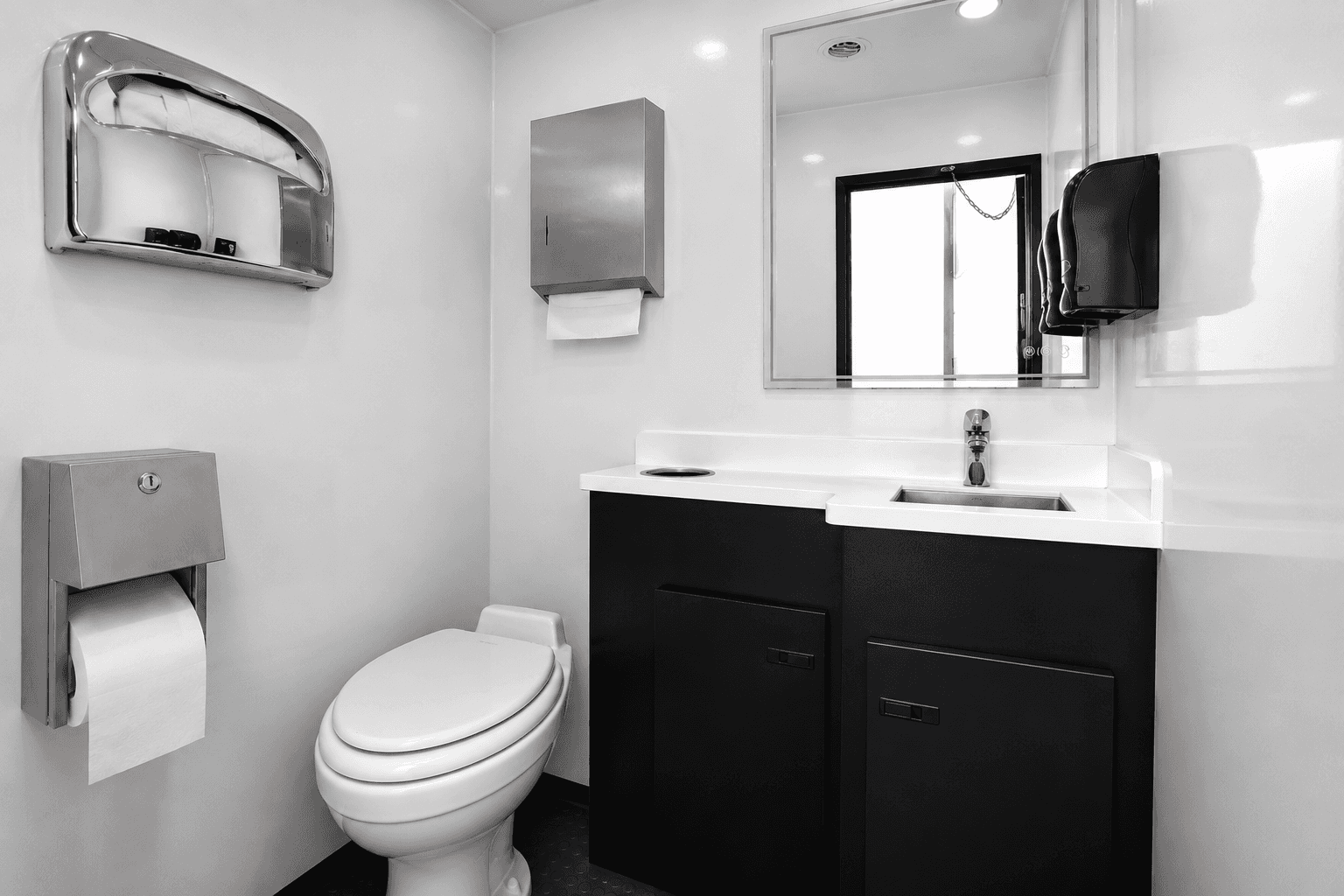 Stainless restroom trailer fixtures with hands-free taps